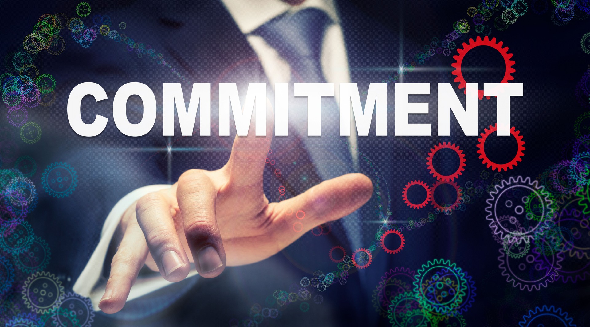 A businessman pressing a Commitment business concept